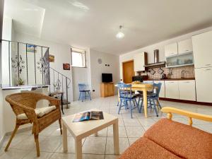 a living room with a couch and a table at Il Riccio Apartment in Procida
