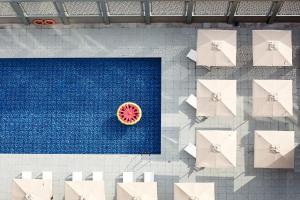 an overhead view of a pool with a watermelon at Rove City Centre in Dubai