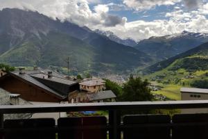 a view of a mountain range from a balcony at COTTAGE LA VILLA in Oga