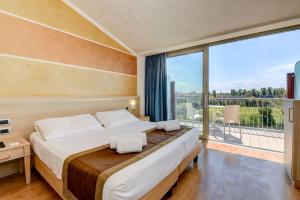 Postel nebo postele na pokoji v ubytování Hotel Rivus