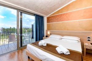 Postel nebo postele na pokoji v ubytování Hotel Rivus