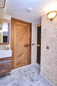A bed or beds in a room at Amber Hotel & Spa