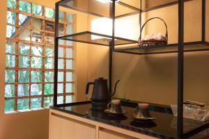 a kitchen with a counter with a tea kettle on it at Tsukihitei in Nara
