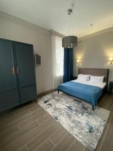 Кровать или кровати в номере Гранд Кавказ Отель