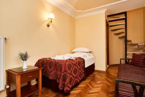 A bed or beds in a room at Amber Hotel & Spa