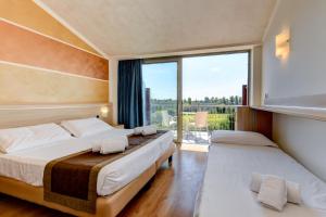 Postel nebo postele na pokoji v ubytování Hotel Rivus