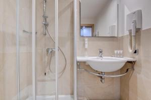 Koupelna v ubytování Hotel Rivus