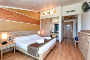 Postel nebo postele na pokoji v ubytování Hotel Rivus