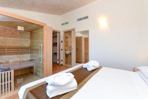Postel nebo postele na pokoji v ubytování Hotel Rivus