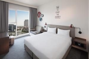 Postel nebo postele na pokoji v ubytování Rove Healthcare City - Bur Dubai