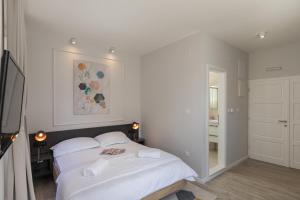 Posteľ alebo postele v izbe v ubytovaní Apartments Urbis