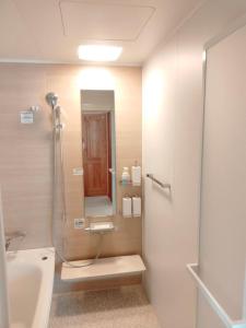 a bathroom with a shower and a sink at CARA-YA(かーらやー） in Ishigaki Island +49 photos