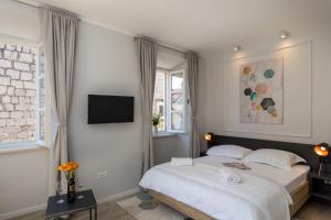 Posteľ alebo postele v izbe v ubytovaní Apartments Urbis