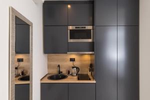 Kuchyňa alebo kuchynka v ubytovaní Apartments Urbis