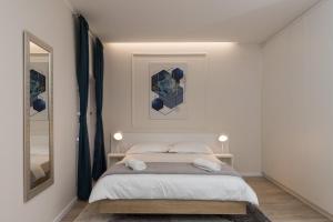 Posteľ alebo postele v izbe v ubytovaní Apartments Urbis