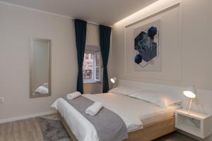 Posteľ alebo postele v izbe v ubytovaní Apartments Urbis