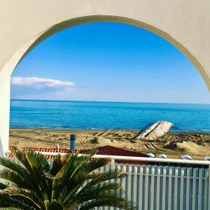 a view of the ocean from a balcony of a beach at Hotel Erika in Caorle