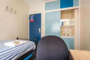 a room with a bed and a desk at LSE Carr-Saunders Hall in London
