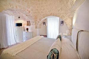 Posteľ alebo postele v izbe v ubytovaní Leonardo Trulli Resort