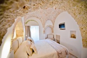 Posteľ alebo postele v izbe v ubytovaní Leonardo Trulli Resort