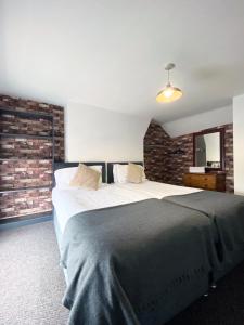 A bed or beds in a room at The Docklands SA by Serviced Living Liverpool