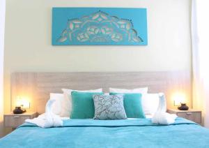 Giường trong phòng chung tại Ocean Garden suite 008 con jardín privado