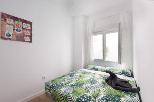 Säng eller sängar i ett rum på Cozy 3 bed apartment in the heart of Alicante