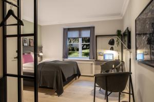 Postel nebo postele na pokoji v ubytování Hotel Fredensborg Store Kro