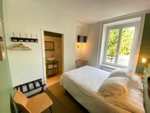 Postel nebo postele na pokoji v ubytování Hotel du Parc