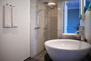 Koupelna v ubytování Hotel Fredensborg Store Kro