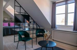 Postel nebo postele na pokoji v ubytování Hotel Fredensborg Store Kro