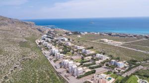 an aerial view of a city with the ocean at Aethrion Villa Lindos in Líndos