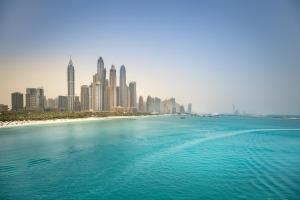 a view of a city with a beach and buildings at Rove Dubai Marina in Dubai