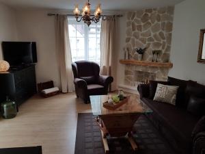 a living room with a couch and a coffee table at Feriendomizil Wetzelberger in Mönichwald