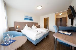 Postel nebo postele na pokoji v ubytování ates Hotel Kehl + 16 fotografií