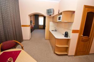 TV a/nebo společenská místnost v ubytování Viva Hotel