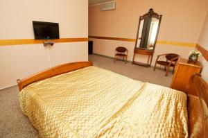TV a/nebo společenská místnost v ubytování Viva Hotel