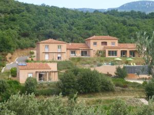 a large house in the middle of a mountain at Domaine de Flo in Saint-Jean-de-la-Blaquière