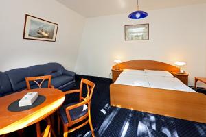 Una cama o camas en una habitación de Hotel Laguna Slapy