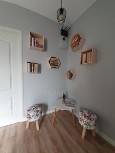 a white room with a table and two chairs at Edith's House in Turda