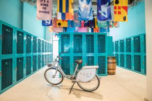 a bike parked in a hallway with lockers at Rove La Mer Beach, Jumeirah in Dubai