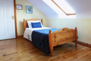 Cama o camas de una habitación en McCarthy's Lodge B&B