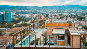 a view of the city from the roof of a building at Hotel Marquee Medellín in Medellín