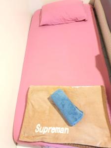 a pink bed with a sponge on top of it at Pangkor Coral Bay Resort(2 bedrooms) in Pangkor +42 photos