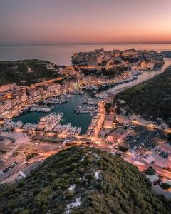 an aerial view of a harbor at night at Hotel la Caravelle in Bonifacio