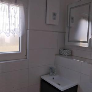 Ein Badezimmer in der Unterkunft Am Schwielochsee 2