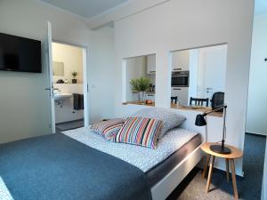 Giường trong phòng chung tại Soltau Apartments