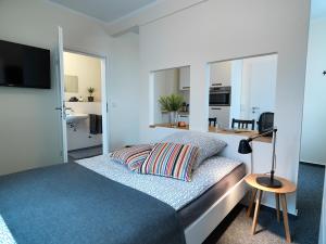 Postel nebo postele na pokoji v ubytování Soltau Apartments