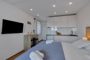 Postel nebo postele na pokoji v ubytování Studio apartmani Buljan