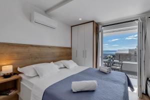 Postel nebo postele na pokoji v ubytování Studio apartmani Buljan